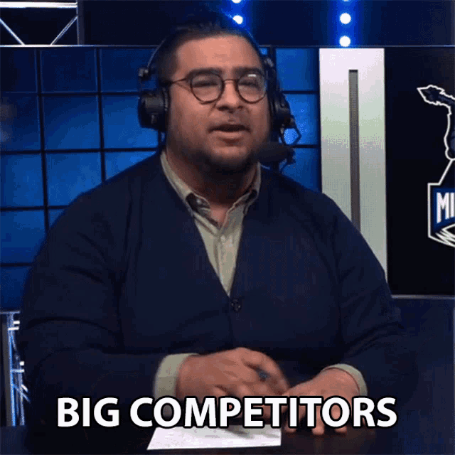 a man wearing headphones says " big competitors "