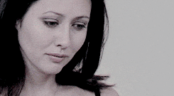 a close up of a woman 's face with her eyes closed
