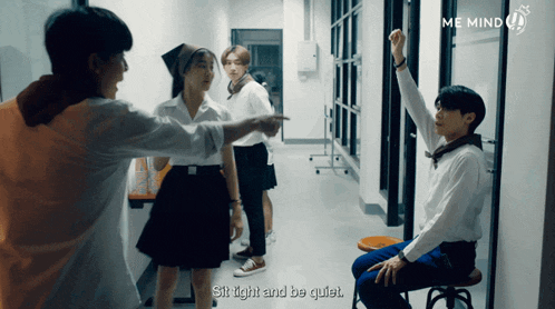 a group of people are standing in a hallway with the words sit tight and be quiet