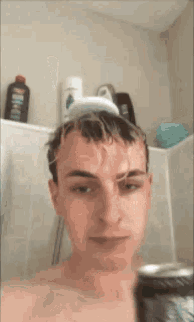 a man is taking a shower and holding a can of soda