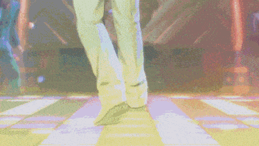 a pixelated image of a man dancing in a disco