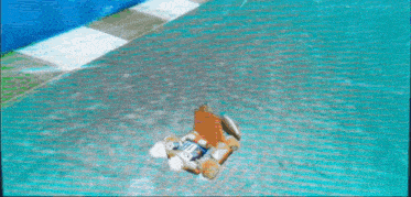 a video game screen shows a car driving on a track