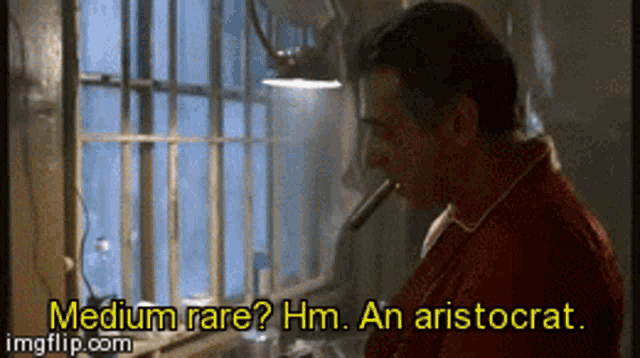 a man in a red shirt is smoking a cigarette and says " medium rare "
