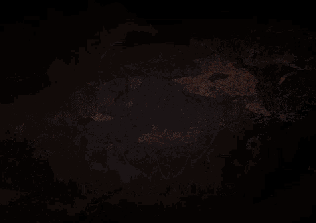 a ring of fire with smoke coming out of it in the dark