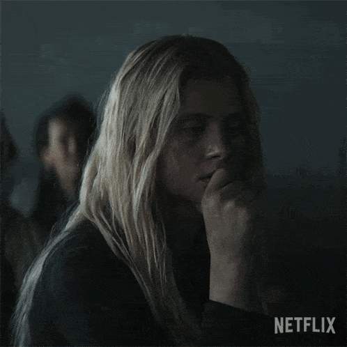 a woman with long blonde hair and a netflix logo on the bottom right