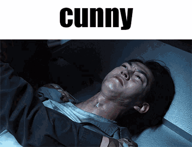 a man laying on a bed with the word cunny on the bottom
