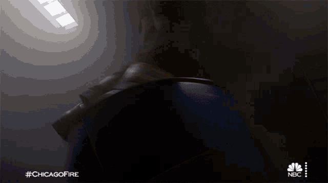a nbc advertisement for chicago fire shows a person jumping off a barrel