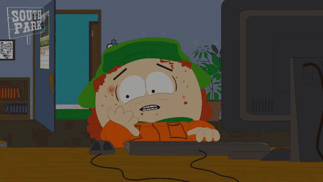 a cartoon character from south park sits in front of a computer screen