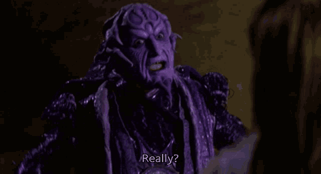 a purple monster is talking to a woman and says really