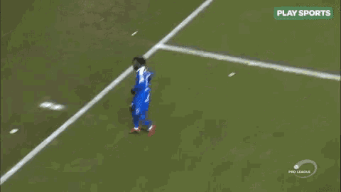 a soccer player wearing a blue jersey with the number 77