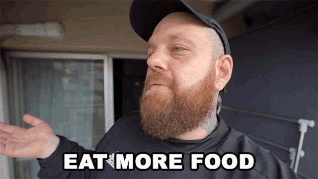 a man with a beard and a hat says eat more food