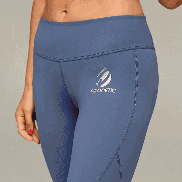 a woman wearing a pair of blue pants that say pironetic on the side