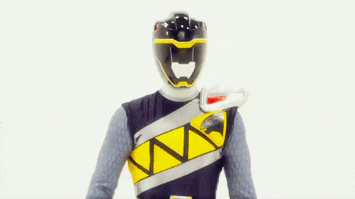 a black and yellow power ranger is jumping in the air with his arms outstretched .