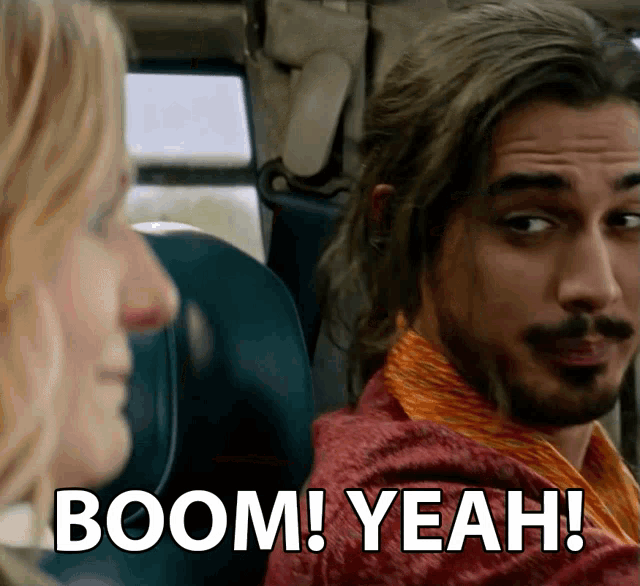 a man and a woman are sitting in a car and the man says boom yeah