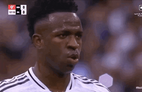 a soccer player is sweating during a game and the score is 0 to 0