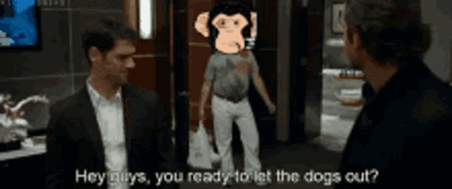 a man in a suit says hey guys you ready to let the dogs out while another man stands behind him