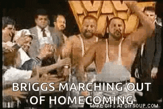 a group of men are standing next to each other with their arms in the air .