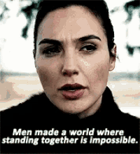 a close up of a woman 's face with a quote that says `` men made a world where standing together is impossible ''