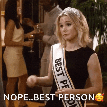 a woman wearing a sash that says ' best person ' on it .