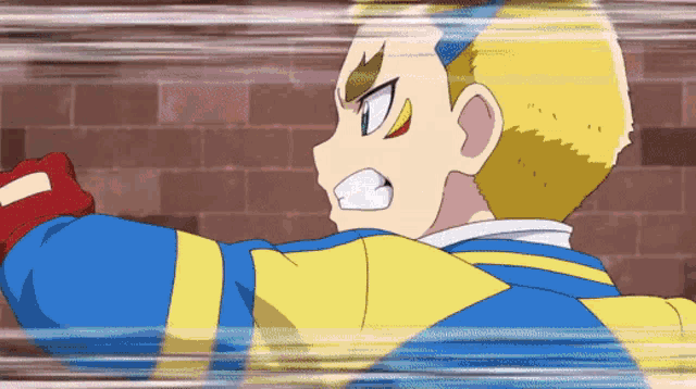 a man in a blue and yellow jacket is standing in front of a brick wall .