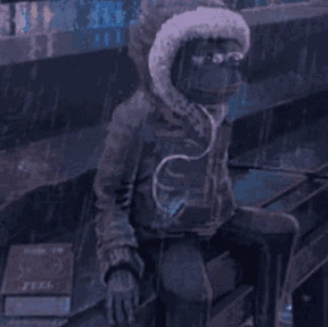 a person wearing a hooded jacket is sitting in the rain next to a book titled feel