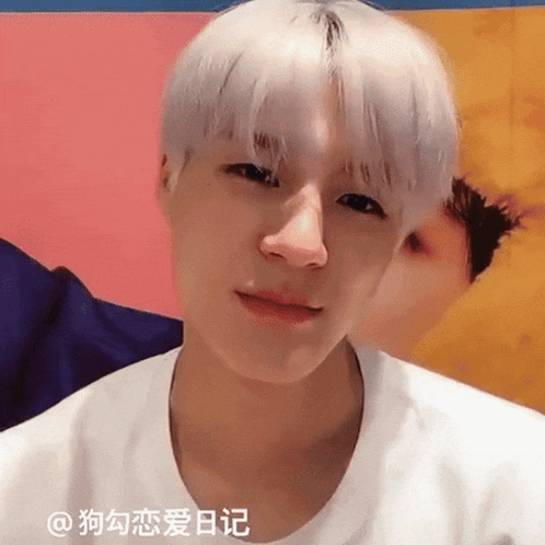 a close up of a person 's face with chinese writing