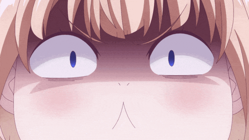 a close up of a person 's face with a surprised look on it