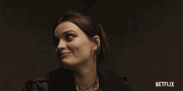 a woman with a netflix logo in the background