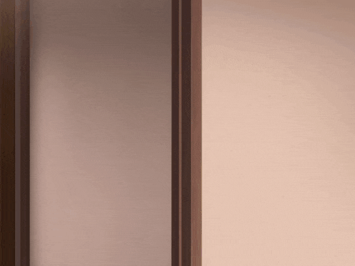 a close up of a brown wall with a wooden frame