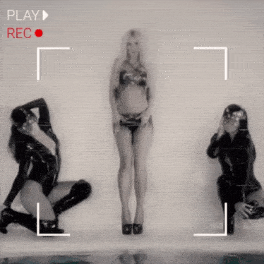 a woman in a bikini is being recorded by a camera with the words play rec on the bottom