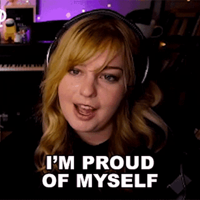 a woman wearing headphones says i 'm proud of myself