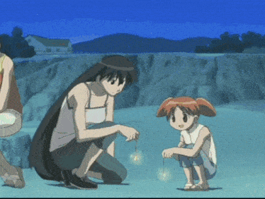 a girl with red hair is kneeling next to a woman