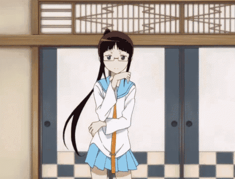 a girl with long black hair and glasses is standing in a room
