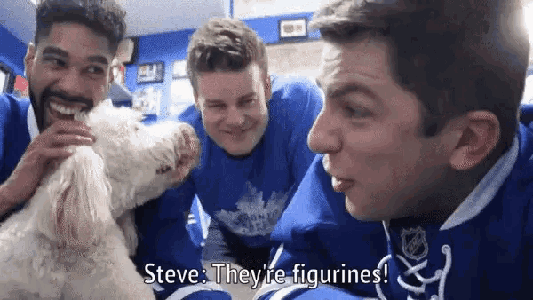 a group of young men are posing for a picture with a white dog and steve they 're figurines