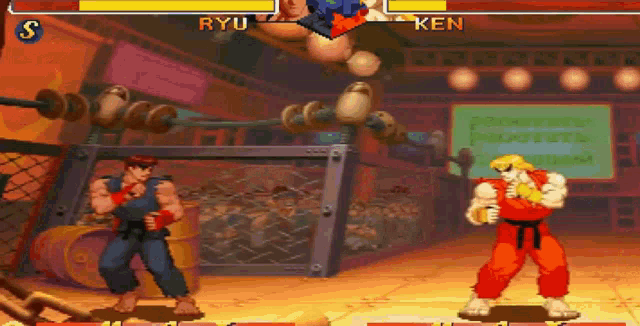 ryu and ken fighting in a video game with a crowd watching