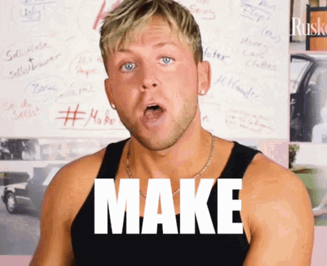 a man in a black tank top with the word make written on it