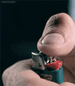 a man is lighting a bic lighter with his finger
