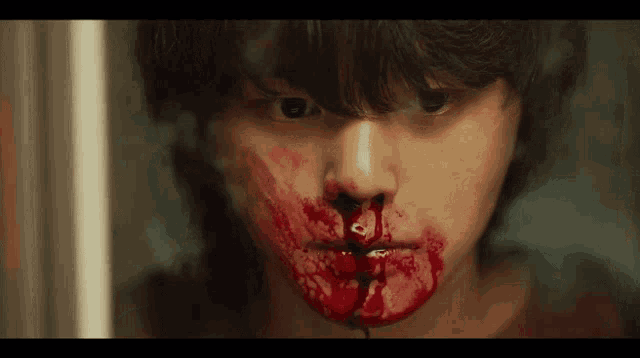 a person with blood coming out of their nose