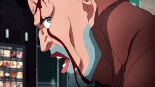 a close up of a man 's face with blood coming out of his mouth