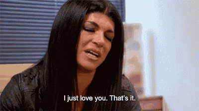 a woman is sitting in front of a window and saying `` i just love you . that 's it . ``