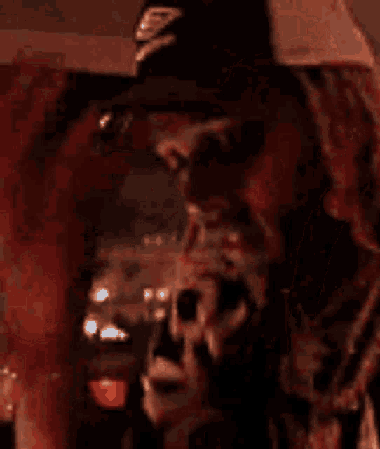 a man and a woman are taking a selfie together in a dark room .