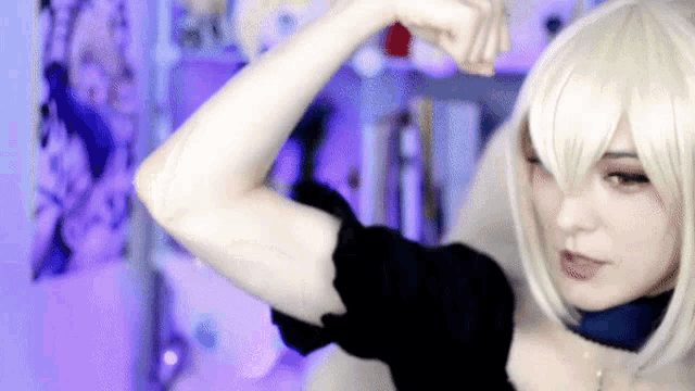 a woman in a cosplay costume is flexing her muscles .