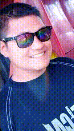 a man wearing sunglasses and a black shirt that says ' ao ' on it