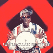 a man is holding a clock with the words subtle clock reminder boyees