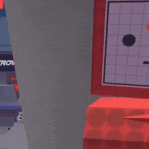 a red box with a face on it is sitting on top of another red box .