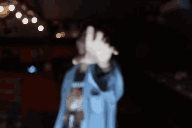 a person 's hand is reaching out towards the camera