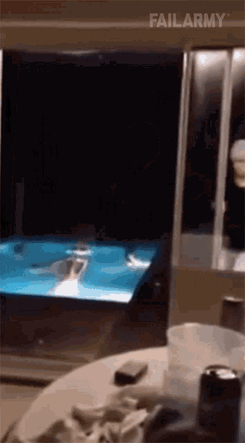 a person is swimming in a pool with failarmy written on the bottom right