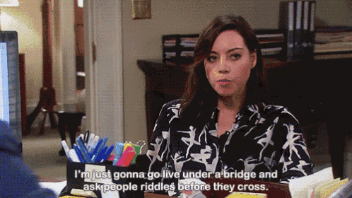a woman is sitting at a desk and says i 'm just gonna go live under a bridge