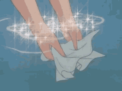 a person is cleaning their hands with a towel .