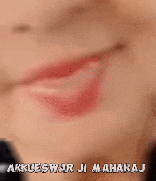 a close up of a woman 's face with the words akkueswar ji maharaj written above her